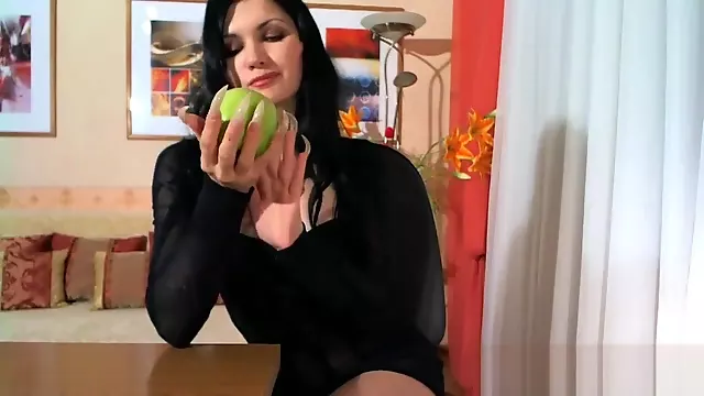 scratching an apple long nails