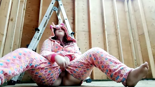 Teen in onesie masturbates in construction area