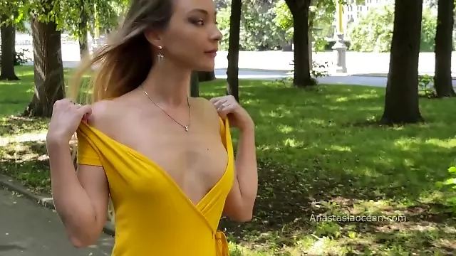 Yelow dress. Topless walk. Beautiful woman expose her tits in public.