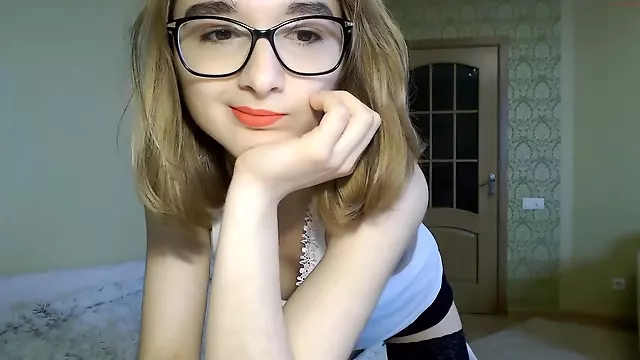 Cute teen Lina in glasses on webcam