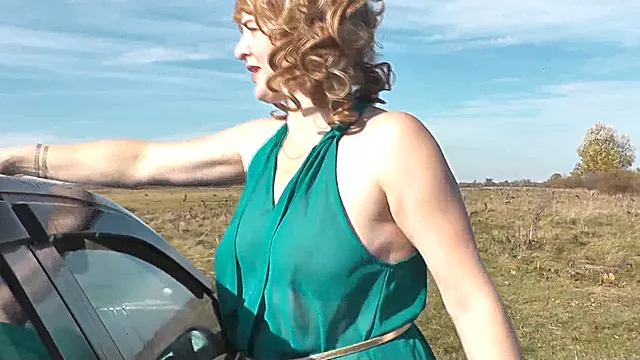 Sexy mature blonde milf washes car by the riverbank without panties and bra under her dress