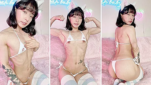 Cute Asian cat girl flexes her toned muscles and flashes her tits and pussy