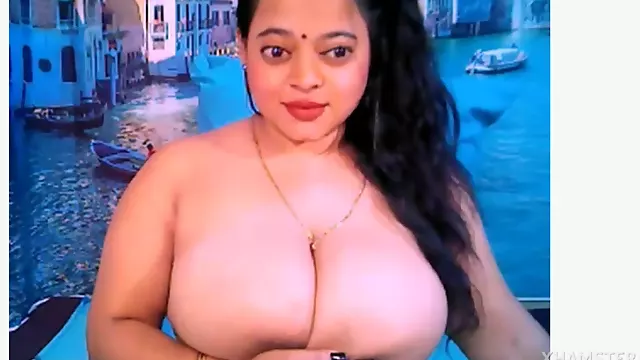 Busty Indian Aunty with big jugs gives a hairy handjob and boob massage in lingerie